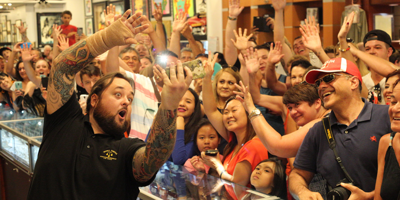 Chumlee from Pawn Stars Gold & Silver Pawn Shop taking a selfie with customers and fans of the Pawn Stars show