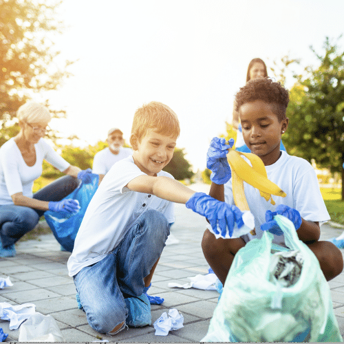 Children and adults working as volunteers to clean up a Las Vegas park.