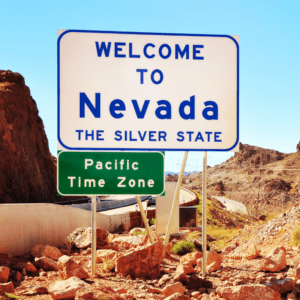 A sign that says Welcome to Nevada The Silver State on a hill in Las Vegas