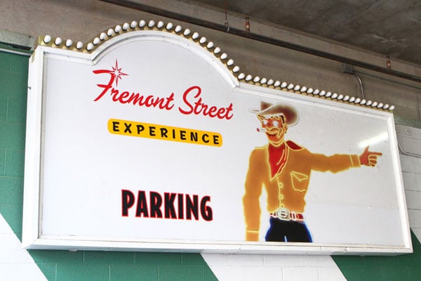 This is a sign for parking at the Fremont Street Experience that features Vegas Vic